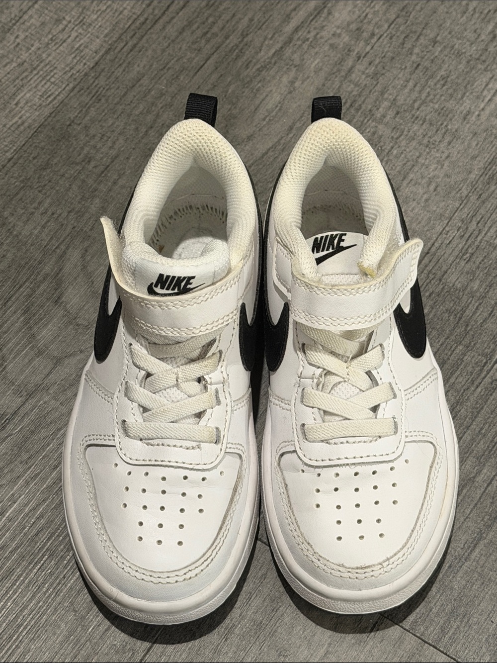 Nike Kids White Sneakers with Black Swoosh